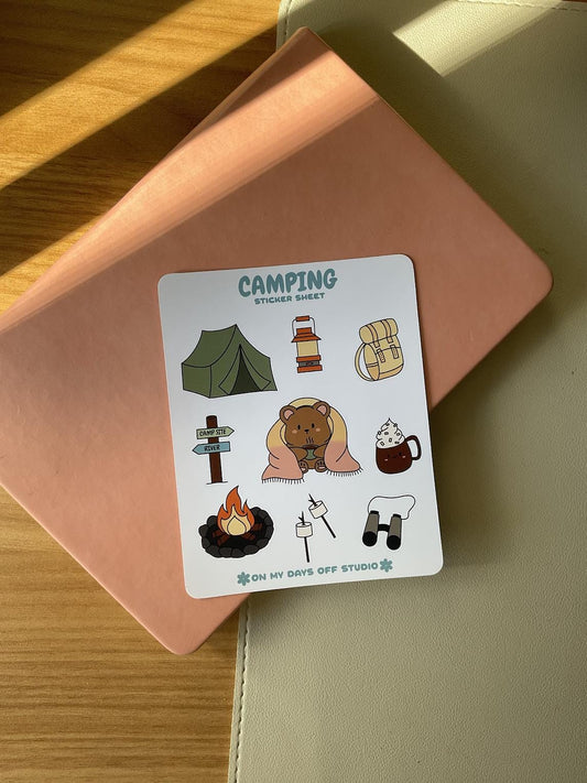 This stationery sticker sheet features a colorful camping theme and has 9 colorful illustrations, including a bear wrapped in a blanket, tent, backpack, fire pit, marshmallows and more. These glossy stickers are perfect for planners and bullet journals. 