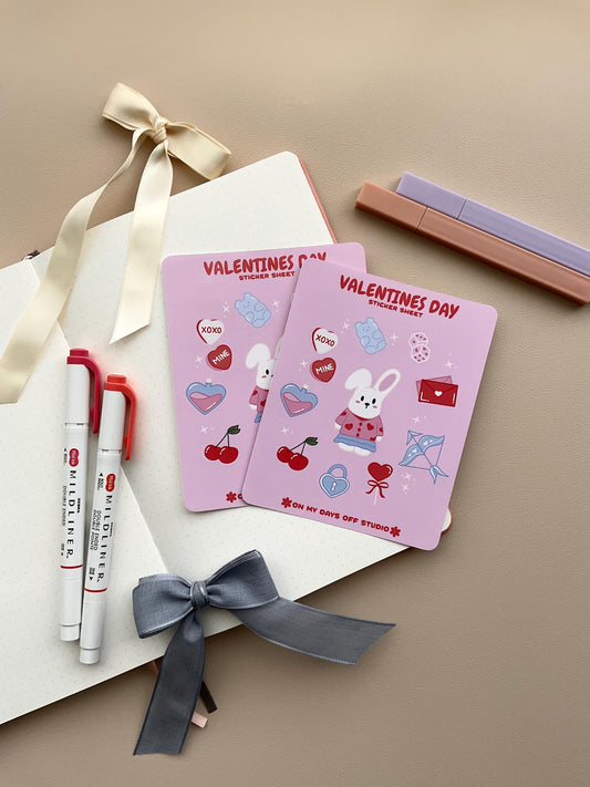 This stationery sticker sheet features a Valentineās Day theme and has 11 colorful illustrations. These illustrations include a cute bunny in a valentine's outfit and heart themed items. These glossy stickers are perfect for planners and bullet journals.