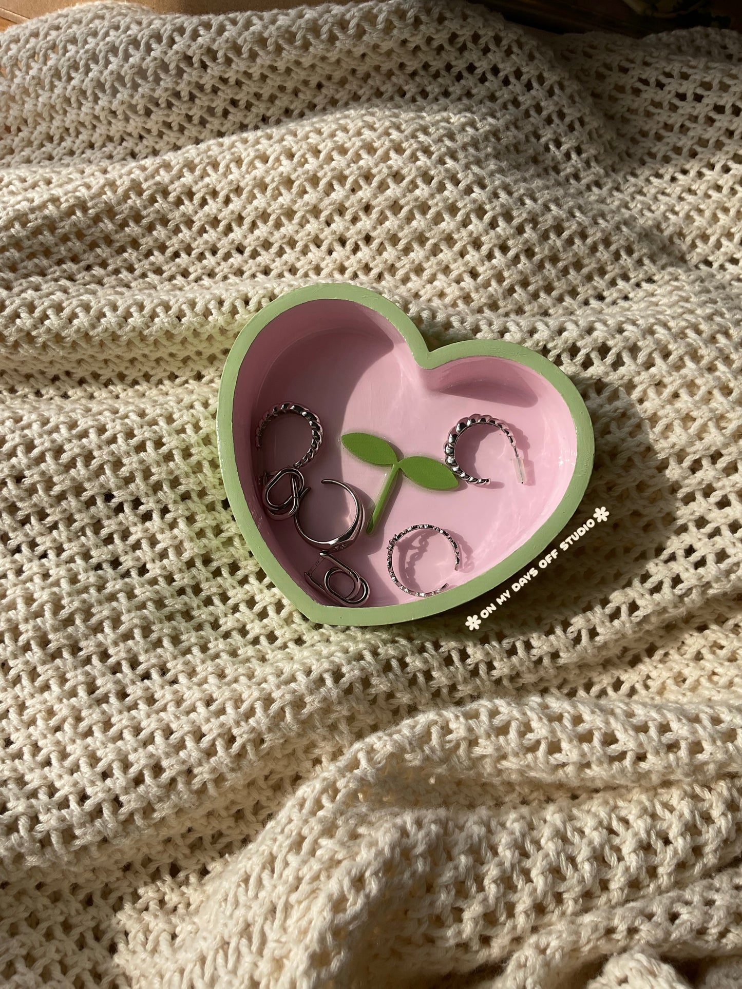 Heart-shaped pink jewelry dish with green edge & green 3D sprout in the center