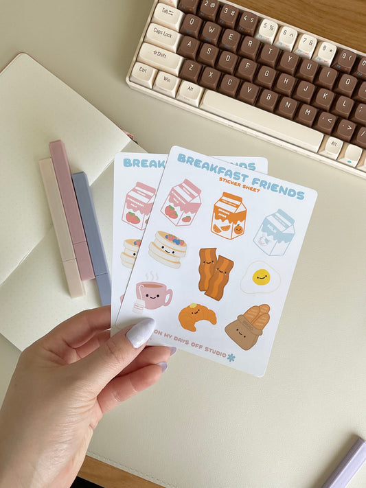 This Breakfast Friends stationery sticker sheet featured 9 kawaii breakfast food illustrations, including strawberry milk, orange juice, milk carton, pancakes, baccon, egg, croissant, tea and french bread. These glossy stickers are perfect for planners and bullet journals. 