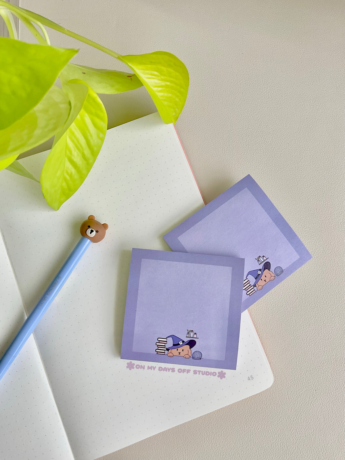 Purple sticky notes with a cute boarder and a dog wizard theme on the bottom edge