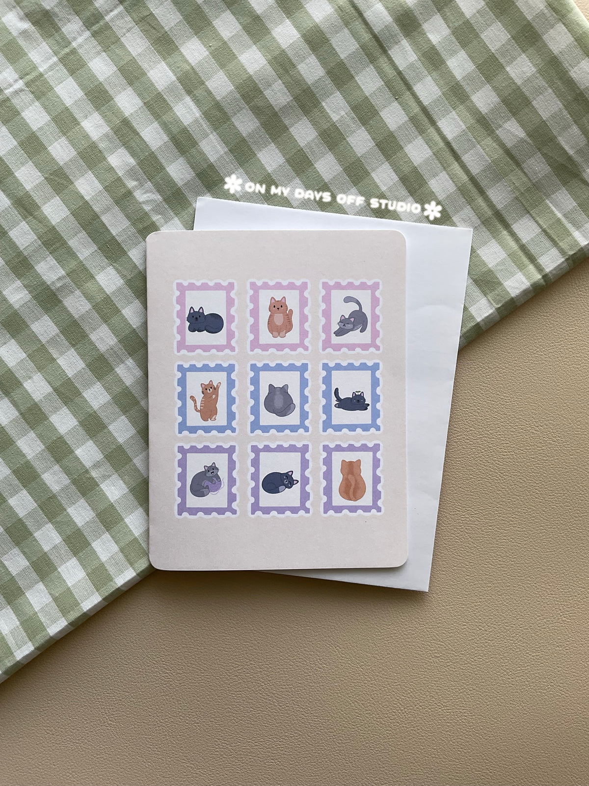 Beige greeting card with a cute cat theme. It features 9 cat themed stamps.