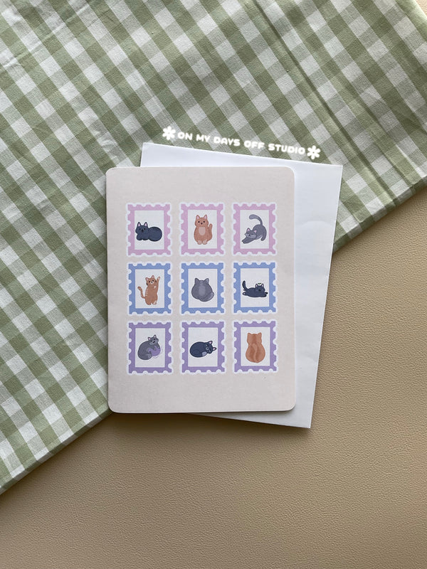 Beige greeting card with a cute cat theme. It features 9 cat themed stamps.