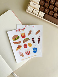 This stationery sticker sheet features an American fast food theme and has 12 colorful illustrations. These food illustrations include classics like hamburger, fries, corn dog, soda, pizza and much more. These glossy stickers are perfect for planners and bullet journals.