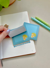 Blue sticky notes with a cat holding an umbrella in the bottom right corner