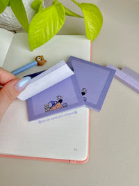 Purple sticky notes with a cute boarder and a dog wizard theme on the bottom edge