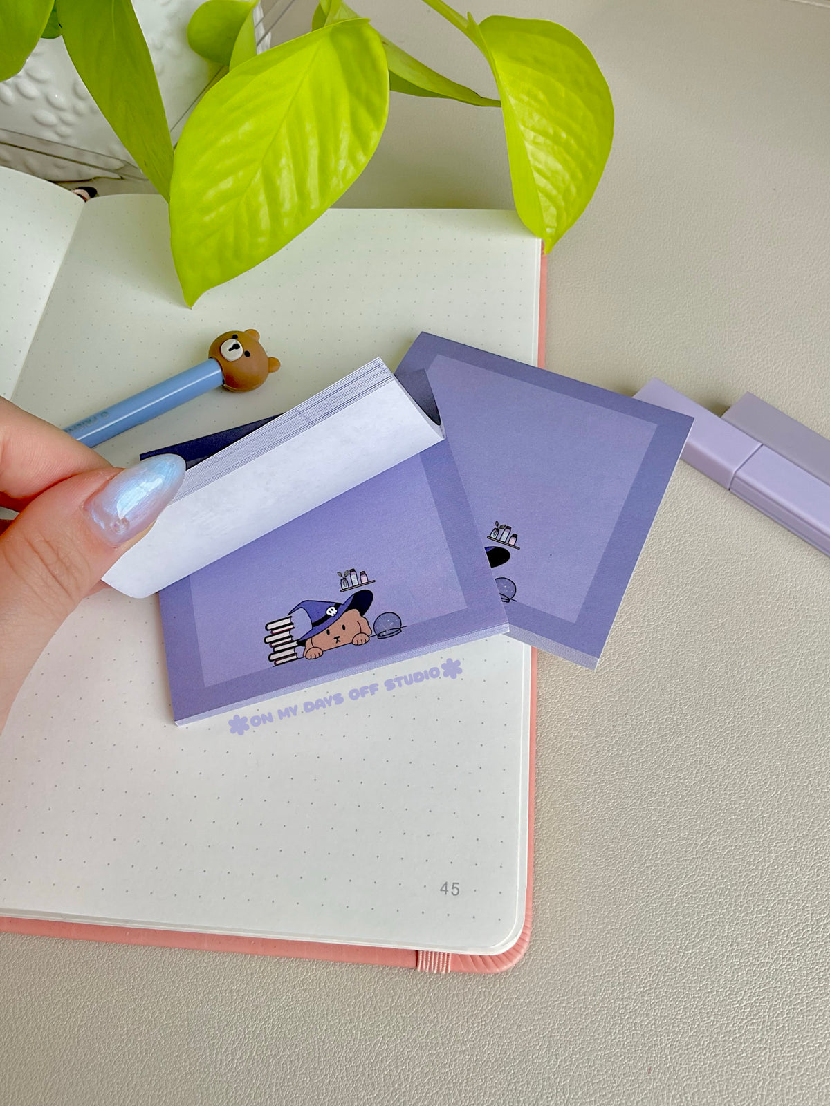 Purple sticky notes with a cute boarder and a dog wizard theme on the bottom edge