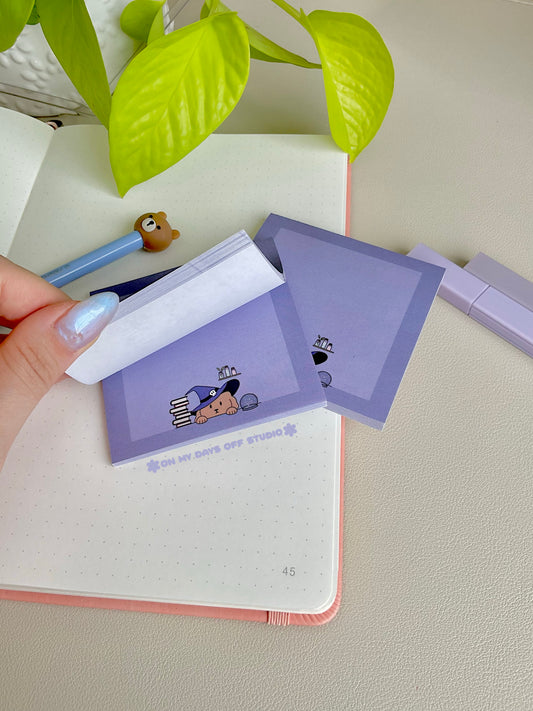 Purple sticky notes with a cute boarder and a dog wizard theme on the bottom edge