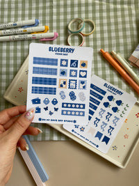 Sticker sheet set with a cute bluberry theme. One sticker sheet has stickers for each day of the week and decor stickers to help bring color to your planner spread. The second sticker sheet has more decor stickers to help create sections to your journal spread.