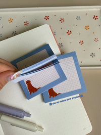Cute grid background sticky notes with a baby blue boarder and adorable gold retriever in the bottom left corner.