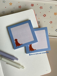 Cute grid background sticky notes with a baby blue boarder and adorable gold retriever in the bottom left corner.