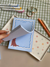 Cute light blue notepad with a retro wavy boarder in white and blue. A cute gold retriever or lab sitting in the bottom left corner