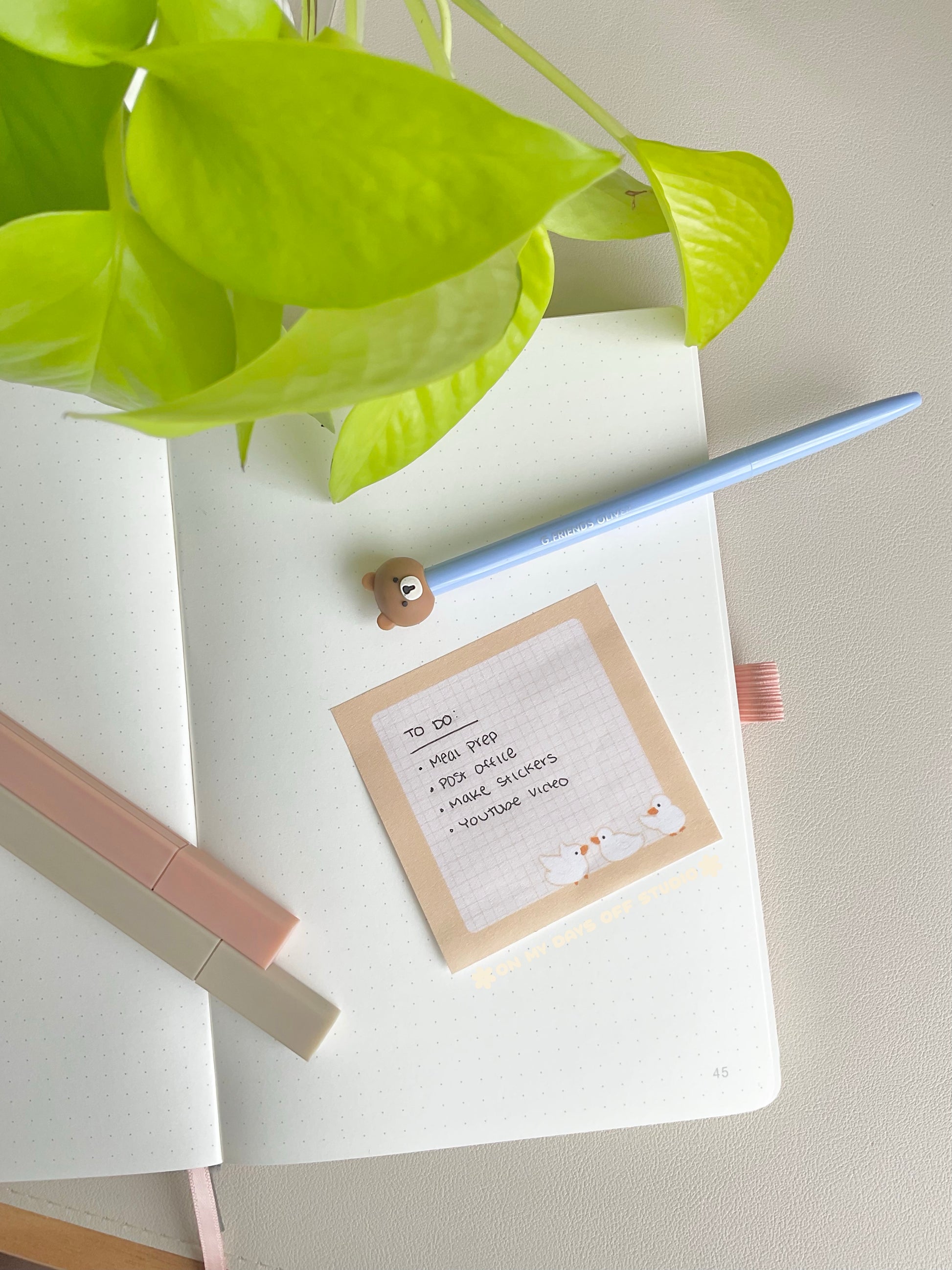 Cute yellow sticky notes with a grid background and 3 yellow ducks in the bottom right corner
