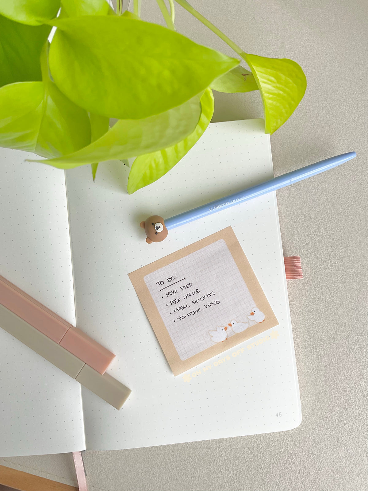 Cute yellow sticky notes with a grid background and 3 yellow ducks in the bottom right corner