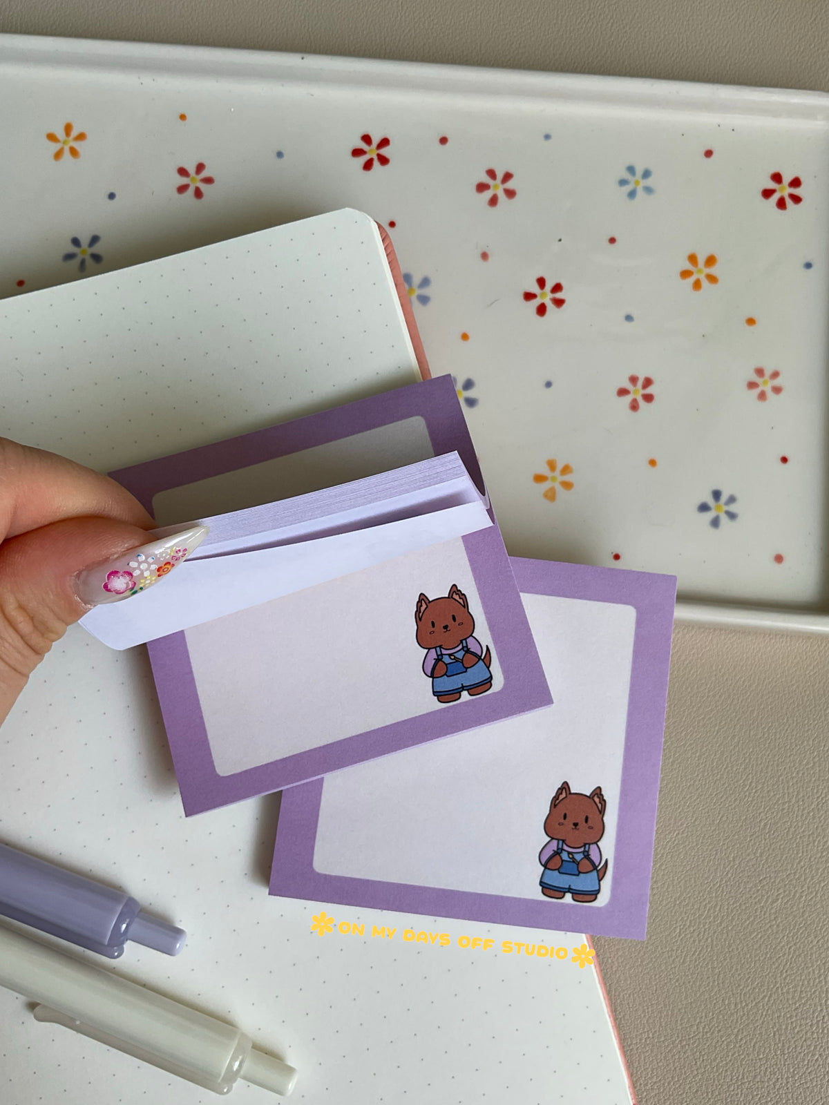 Cute grid background sticky notes with a light purple boarder and adorable character in the right corner. The character is a original with a painters overalls on