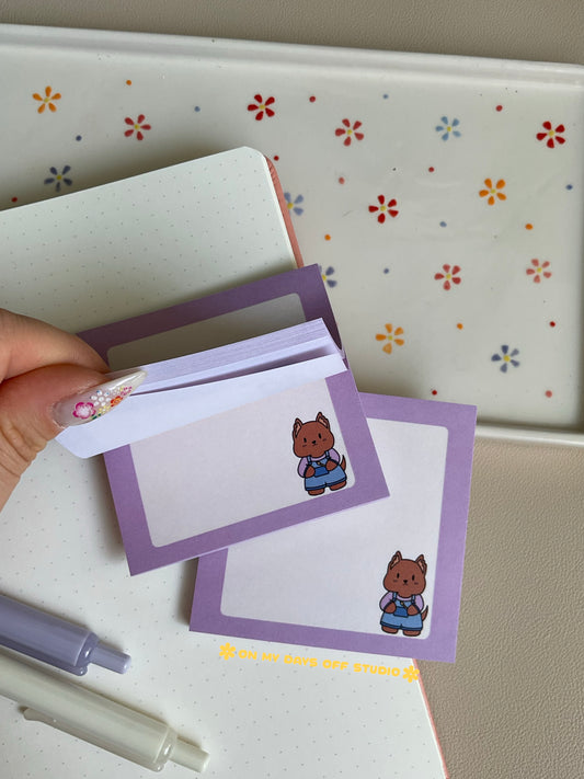 Cute grid background sticky notes with a light purple boarder and adorable character in the right corner. The character is a original with a painters overalls on