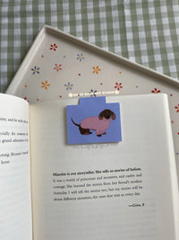 Dachshund wearing a pink sweater magnetic bookmark