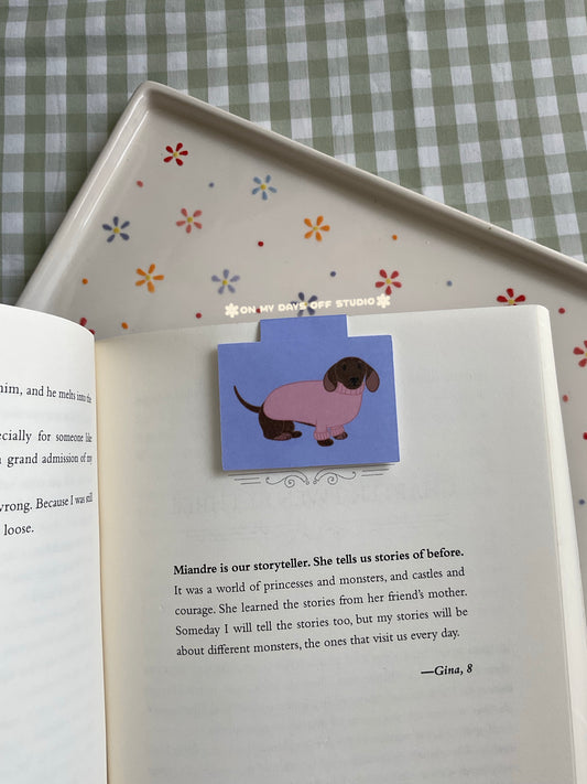 Dachshund wearing a pink sweater magnetic bookmark
