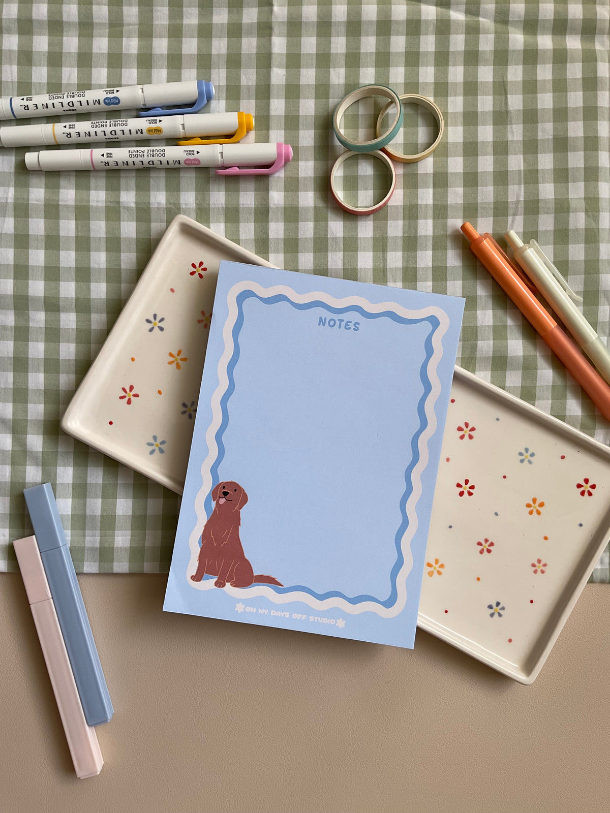 Cute light blue notepad with a retro wavy boarder in white and blue. A cute gold retriever or lab sitting in the bottom left corner