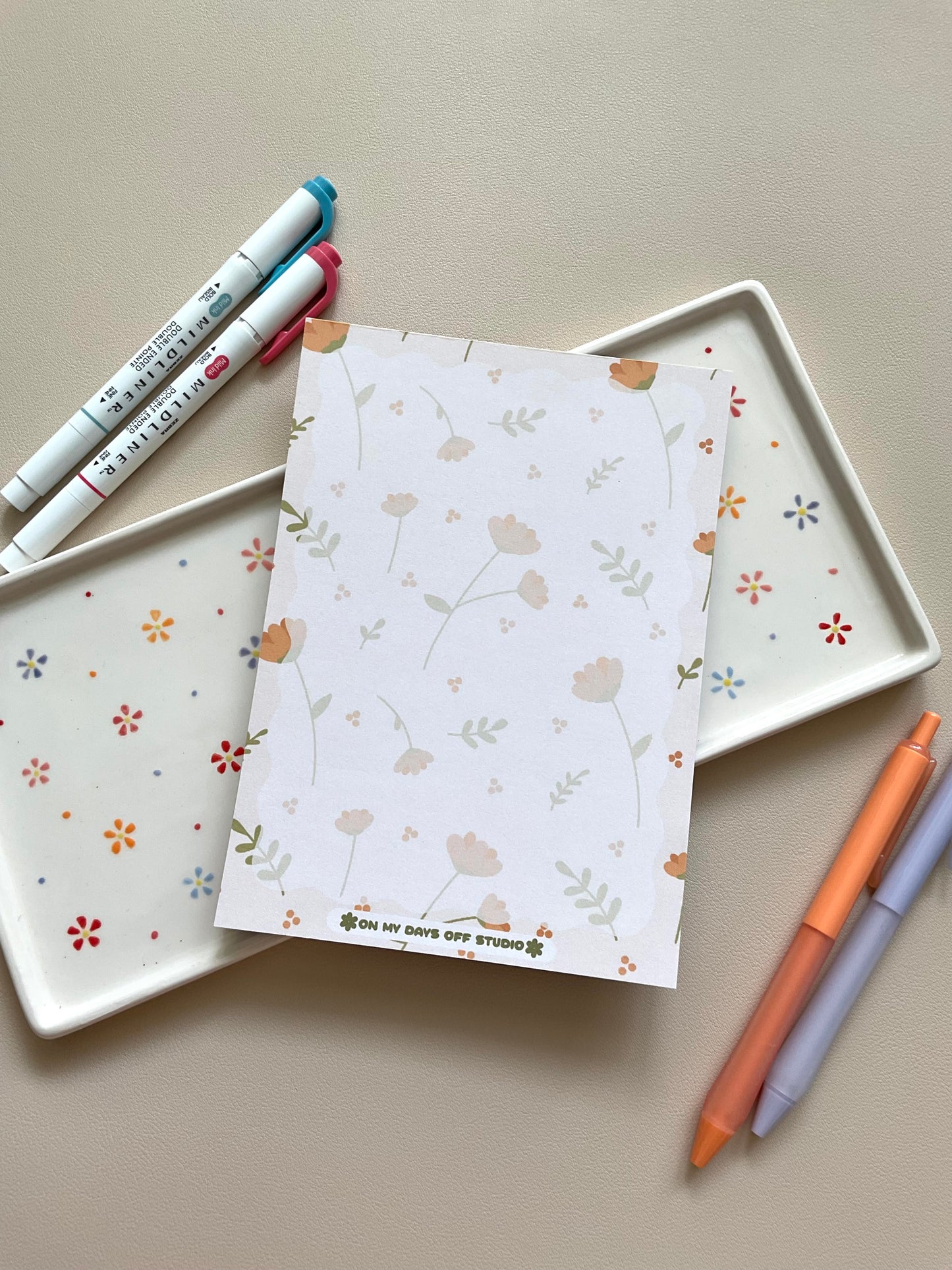 Floral notepad with beige background