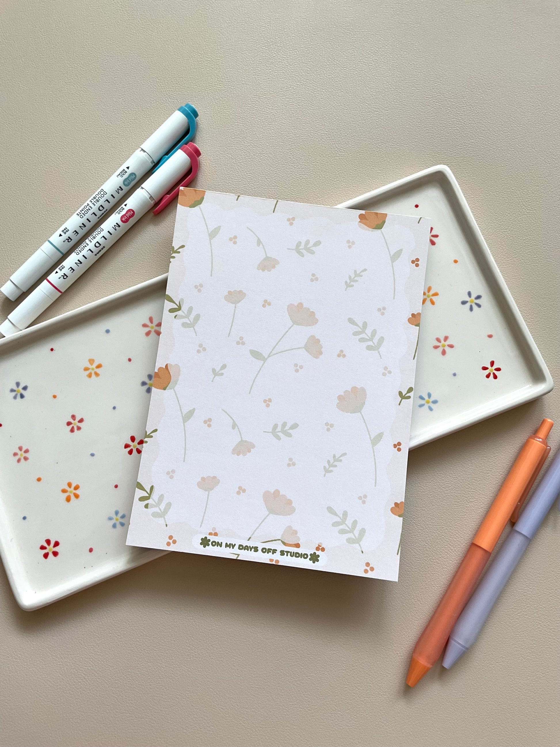 Floral notepad with beige background