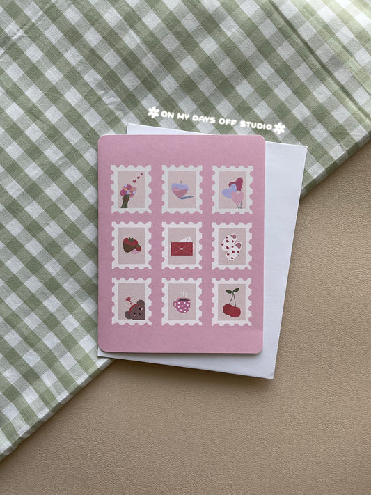 Pink greeting card with a valentines theme. It features 9 valentines themed stamps.