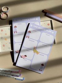 Weekly planner with a purple and dog theme. It has sections for every day of the week and for notes.