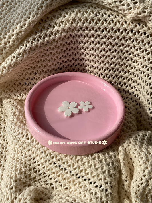 Pink jewelry dish or trinket holder with raised cherry blossom design