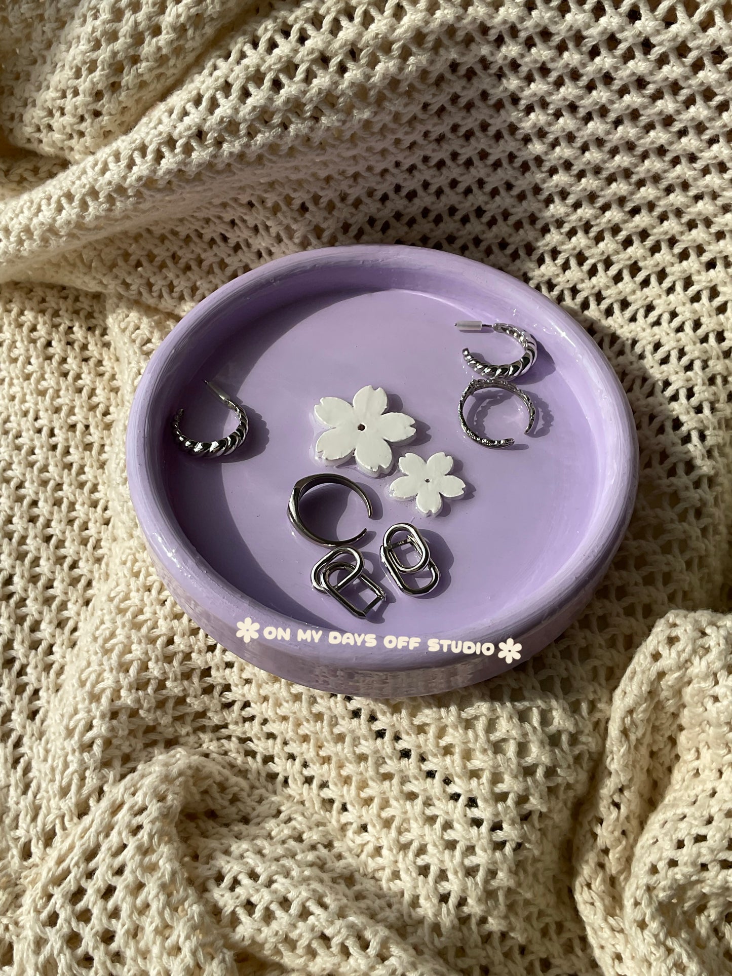 Purple jewelry dish or trinket holder with raised cherry blossom design