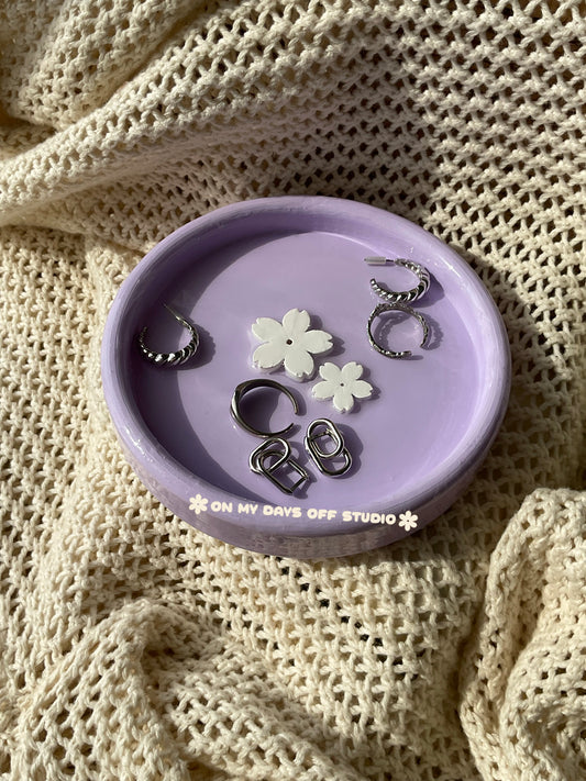 Purple jewelry dish or trinket holder with raised cherry blossom design