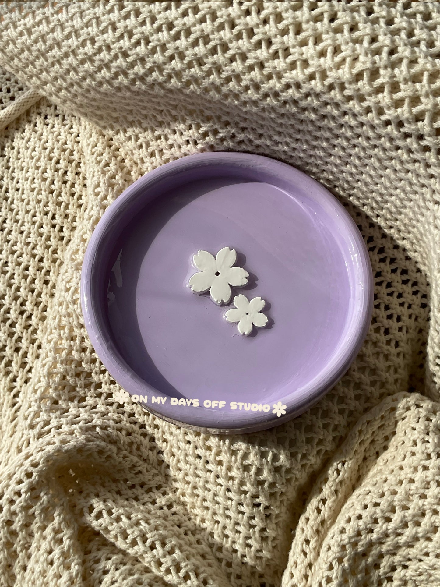 Purple jewelry dish or trinket holder with raised cherry blossom design