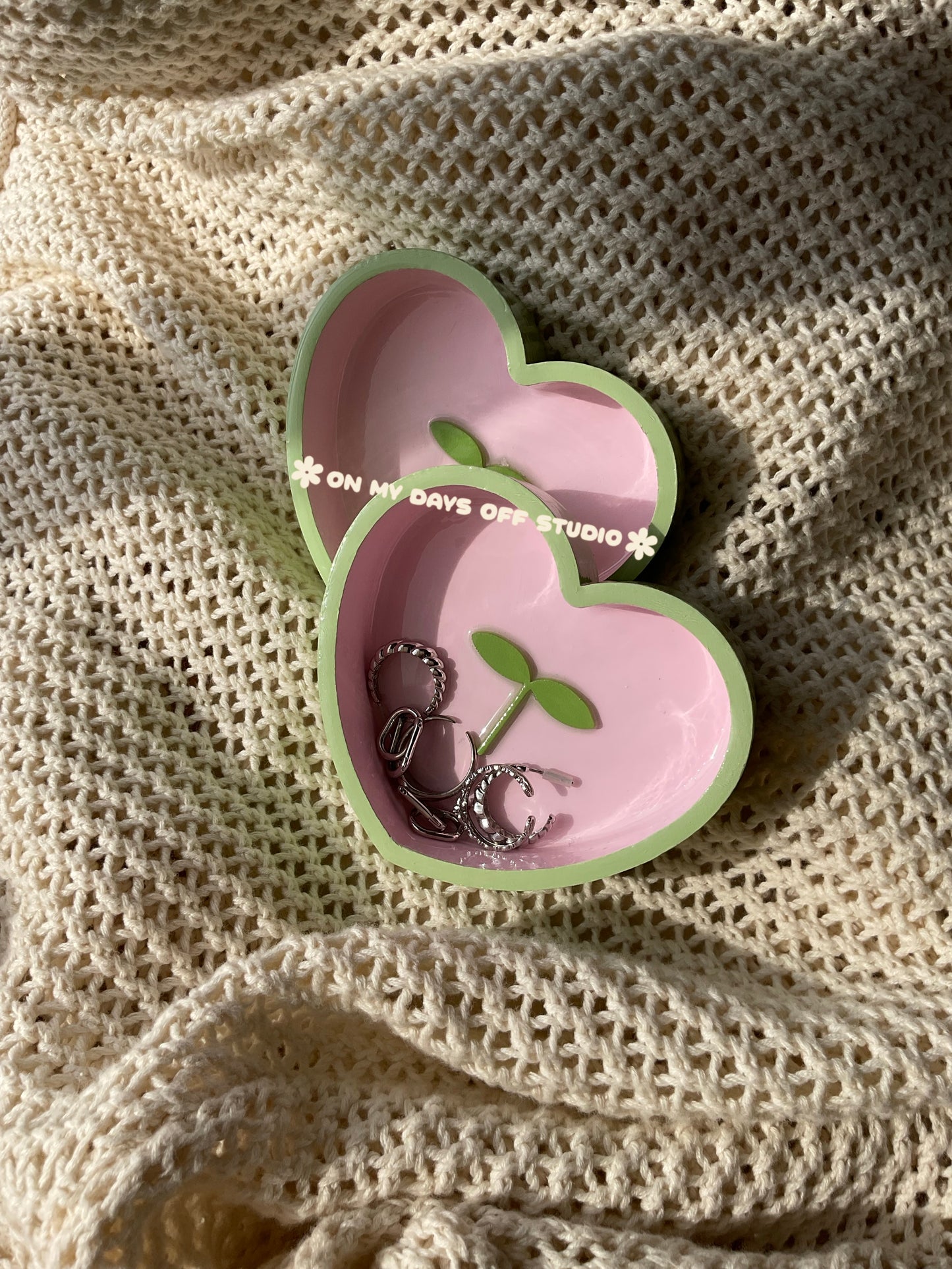 Heart-shaped pink jewelry dish with green edge & green 3D sprout in the center