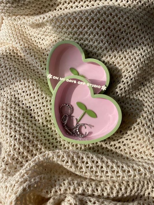 Heart-shaped pink jewelry dish with green edge & green 3D sprout in the center