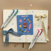 This stationery sticker sheet features a Hawaii Trip theme and has 11 colorful illustrations. This sticker sheet includes a dog in a grass skirt and other island items like a surf board, pineapple, coconut drink, and sea shells. These glossy stickers are perfect for planners and bullet journals.&nbsp;