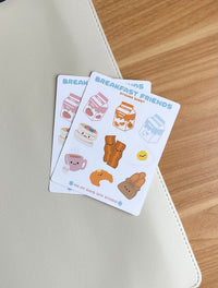This Breakfast Friends stationery sticker sheet featured 9 kawaii breakfast food illustrations, including strawberry milk, orange juice, milk carton, pancakes, baccon, egg, croissant, tea and french bread. These glossy stickers are perfect for planners and bullet journals.&nbsp;