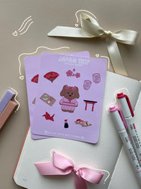 This stationery sticker sheet features a Japan theme and has 10 colorful illustrations, including a dog in a Japanese traditional dress, hand fan, green tea, matcha set, cherry blossoms, sushi and more. These glossy stickers are perfect for planners and bullet journals.&nbsp;